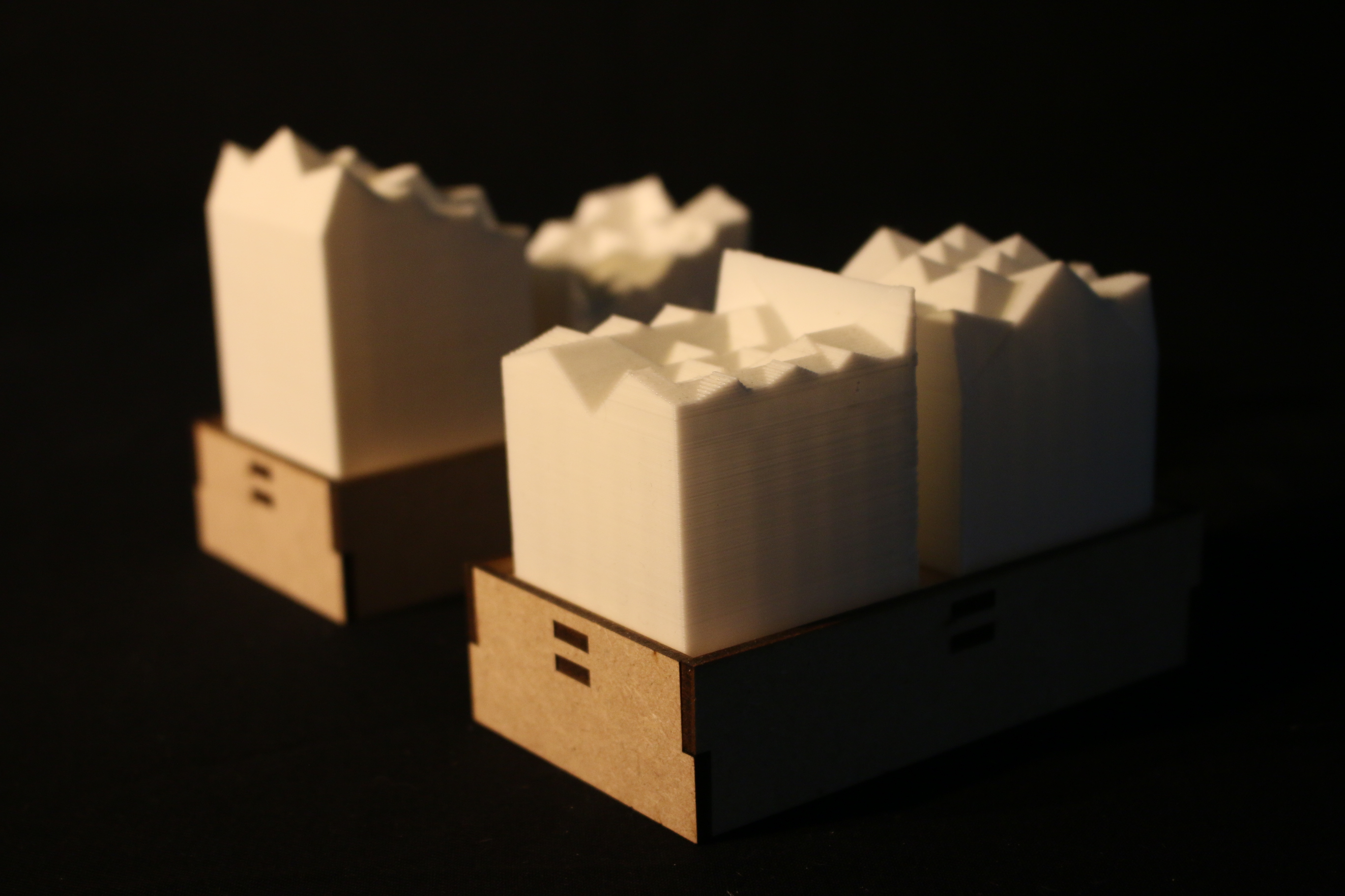 Robotic arm printing an interlocking clay unit
